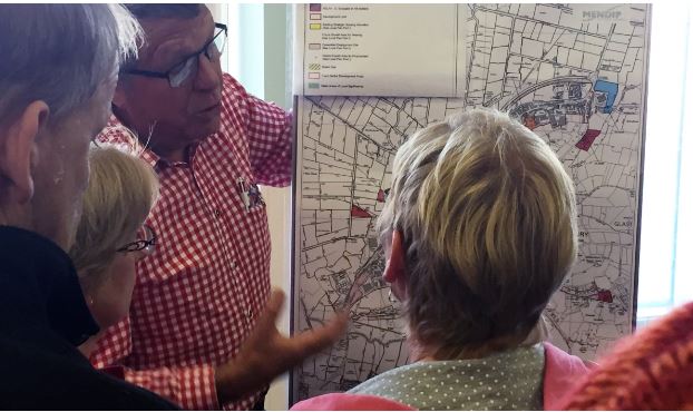 Neighbourhood Plan officer, Gerard Tucker showing residents the District Council Local Plan development maps.
